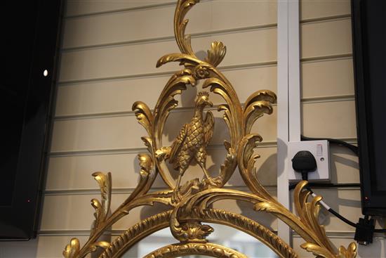 A Victorian oval gilt wall mirror, 4ft 11in. x 2ft 9.5in.